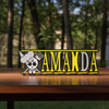 Personalized one piece nameplate with the Sanji jolly roger on a wooden table
